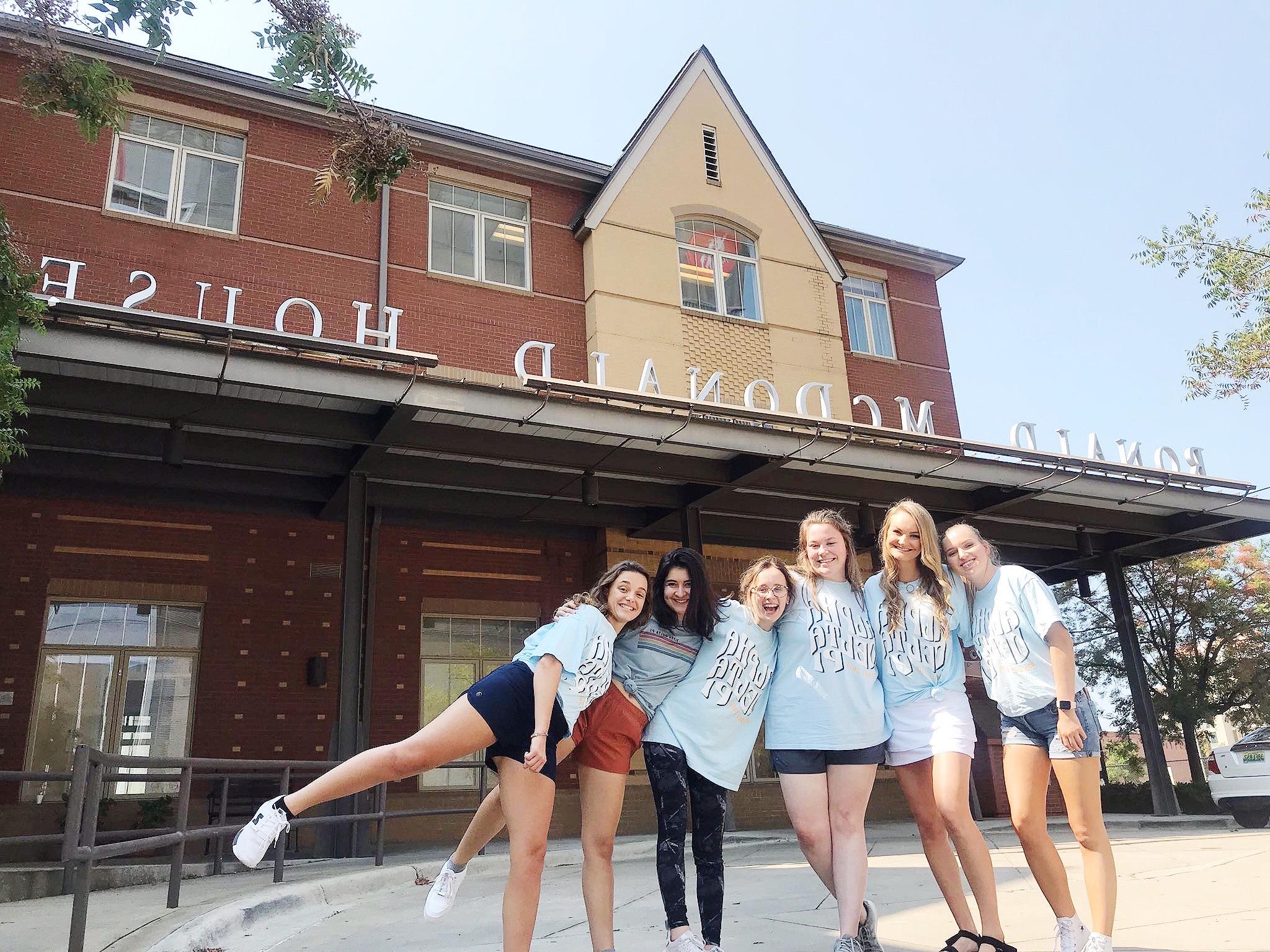 Members of Alpha Delta Pi pose for a photo outside of the Ronald McDonald House Charities.